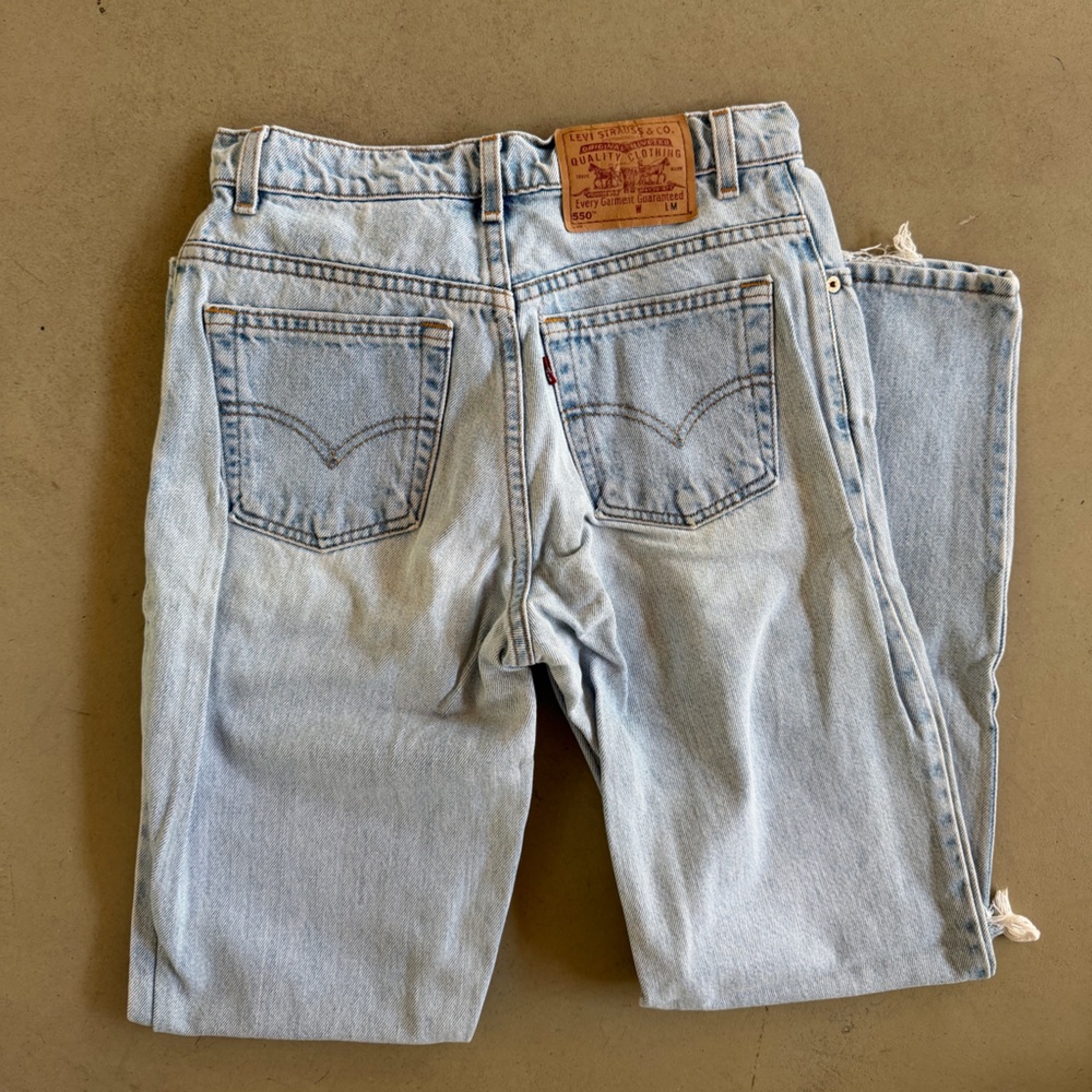 vintage Light wash Distressed levi’ Jeans